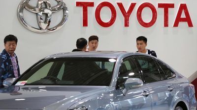 Image for story: Toyota reports dip in quarterly profit, projects recovery