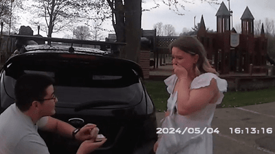 Image for story: Engagement surprise: Police help man propose during fake traffic stop