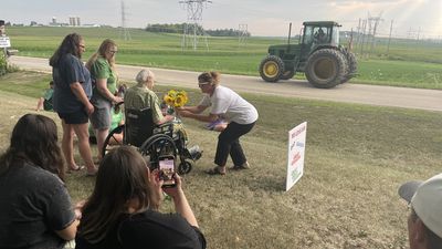 Image for story: Community rallies  to give hospice patient a 'last smile' with John Deere parade