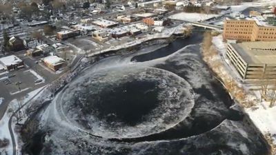 Image for story: Giant spinning ice disk draws crowd of chilly onlookers in Maine