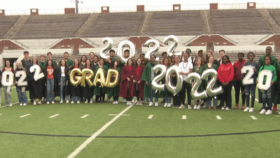 Image for story: High school's graduating class has 35 pairs of twins and a set of triplets