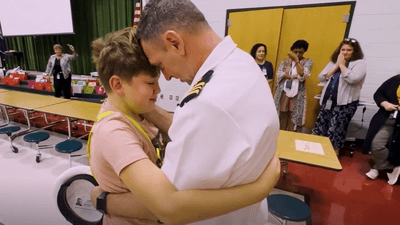 Image for story: WATCH: Navy commander returns from service, surprises sons at schools