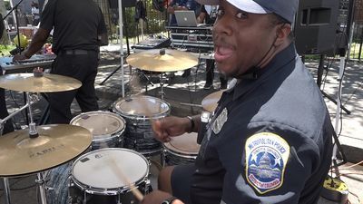 Image for story: Meet the DC police officers who bring funk and go-go music to city streets each summer