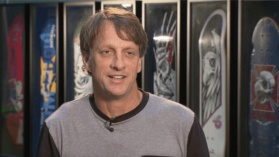 Image for story: Thanks to TikTok and a FedEx driver, boy exchanges skateboards with his idol Tony Hawk