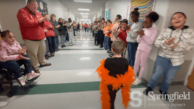 Image for story: VIDEO: Students, staff line hallway to celebrate kindergartener beating cancer