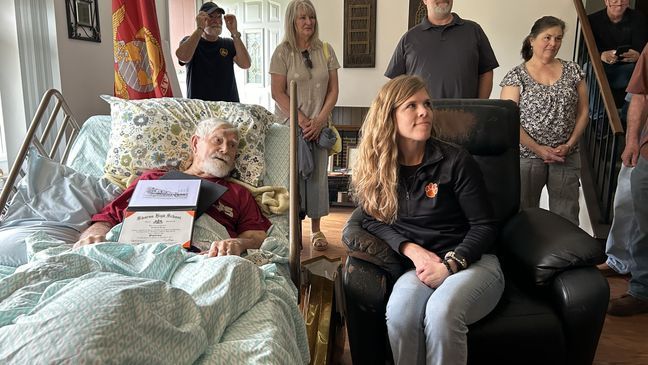 98-year-old Richard Remp receives a high school diploma, 71 years after he dropped out of high school to fight the Nazis during World War II. (WJLA) 