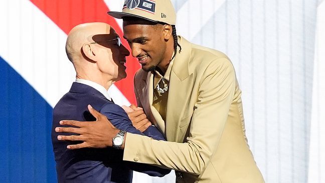 Alex Sarr, right, greets NBA commissioner Adam Silver after being selected as the second pick in the NBA basketball draft during the first round by the Washington Wizards, Wednesday, June 26, 2024, in New York. (AP Photo/Julia Nikhinson)