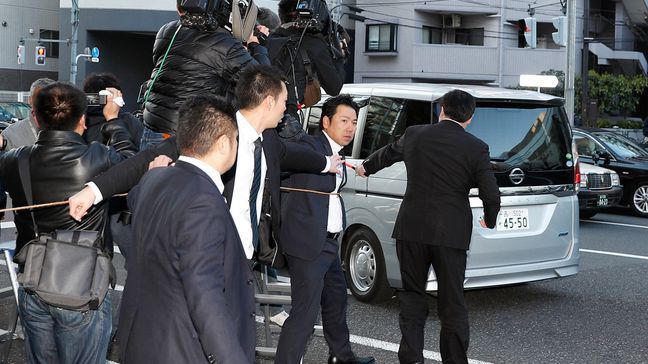 A car which is believed to be carrying Nissan former Chairman Carlos Ghosn leaves an apartment building early Thursday, April 4, 2019 in Tokyo. (Takuya Inaba/Kyodo News via AP)/Kyodo News via AP)