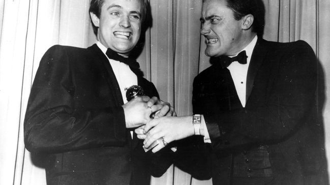 David McCallum and Robert Vaughn, stars of the television spy series 'The Man From UNCLE', pretend to fight over the Golden Globe Award they received for 'the most popular television series' at the Hollywood Foreign Press Association's annual award dinner.    (Photo by Keystone/Getty Images)