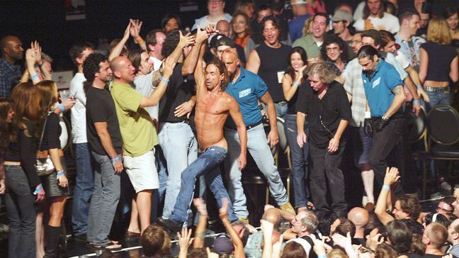 Iggy Pop And The Stooges perform during an MTV2 benefit concert event, benefitting "LIFEbeat: The Music Industry Fights AIDS", at the Roseland Ballroom August 27, 2003 in New York City. (Photo by Scott Gries/Getty Images)