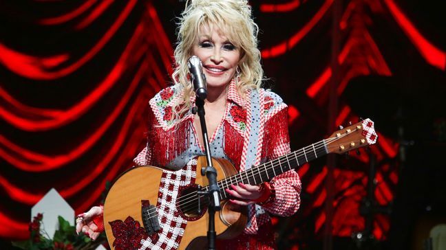 FILE - Dolly Parton performs at Austin City Limits Live during Blockchain Creative Labs' Dollyverse event during the South by Southwest Music Festival on March 18, 2022, in Austin, Texas. (Photo by Jack Plunkett/Invision/AP, File)