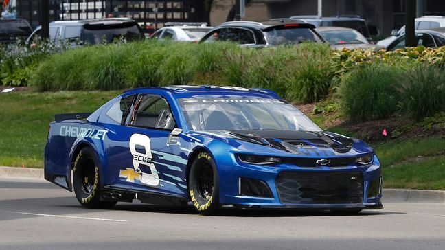 Jimmie Johnson drives the 2018 Chevrolet Camaro ZL1, a new race car for the Monster Energy NASCAR Cup Series, down Jefferson Avenue during a news conference in Detroit, Thursday, Aug. 10, 2017. The new Camaro will make its on-track debut during the 2018 Daytona 500 auto race. (AP Photo/Paul Sancya)