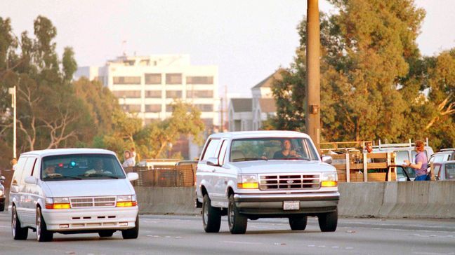 FILE - Al Cowlings, with O.J. Simpson hiding, drives a white Ford Bronco as they lead police on a two-county chase along the northbound 405 Freeway towards Simpson's home, June 17, 1994, in Los Angeles. (AP Photo/Lois Bernstein, File)