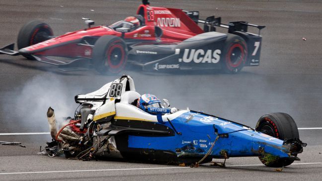 Scott Dixon, of New Zealand, sits in the remains of his car after going airborne in a crash during the running of the Indianapolis 500 auto race at Indianapolis Motor Speedway, Sunday, May 28, 2017, in Indianapolis. (AP Photo/Bud Cunningham)