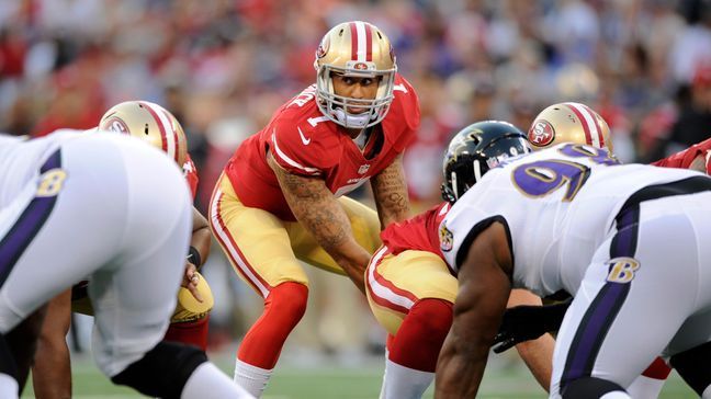 San Francisco 49ers quarterback Colin Kaepernick prepares to run a play in the first half of an NFL preseason football game against the Baltimore Ravens, Thursday, Aug. 7, 2014, in Baltimore. (AP Photo/Nick Wass)