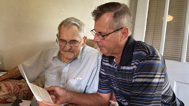 John S. Jennings Sr. and his son Donnie reading letters. taken on September 8, 2022. (Credit: Jacob Hunziker, WSET)