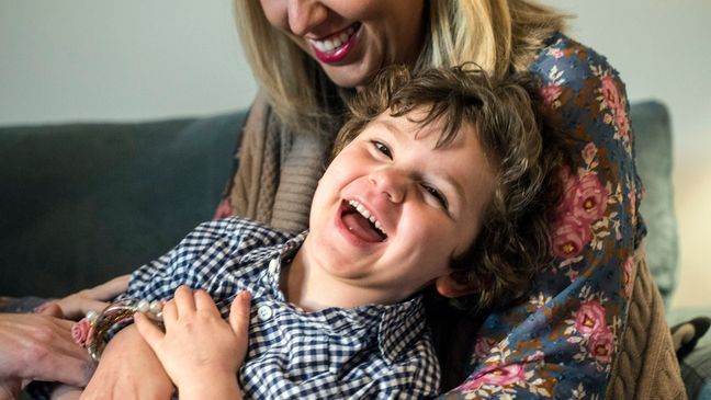 Henry Bischoff laughs when the family moves in on a group tickle attack on Feb. 8, 2018 in Louisville, Ky. His mother, Bekah, who developed preeclampsia during two pregnancies and now helps other moms who’ve had the condition, said she was diagnosed late in the third trimester both times. While pregnant with Henry in 2012, she found out she had a very severe type called HELLP Syndrome at 36 weeks. He was delivered that day. She nearly died. (Marty Pearl/Courier Journal via AP)