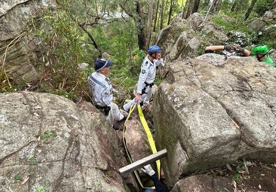 Image for story: Woman rescued after spending hours 'hanging by her feet' between boulders 