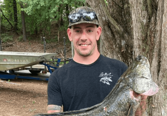 Image for story: Maryland man catches 19.8-pound snakehead fish, just short of state record