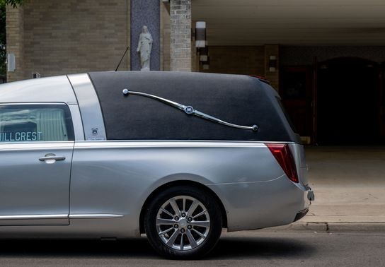 Image for story: Funeral home apologizes after body falls out of hearse onto busy road