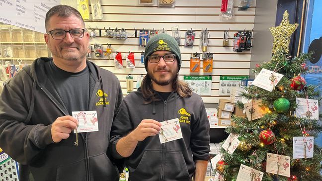 Jonathan Issa, alongside his son Zachary, hold up their magic Santa keys to help the big guy get into homes on Christmas night. (WJAR)