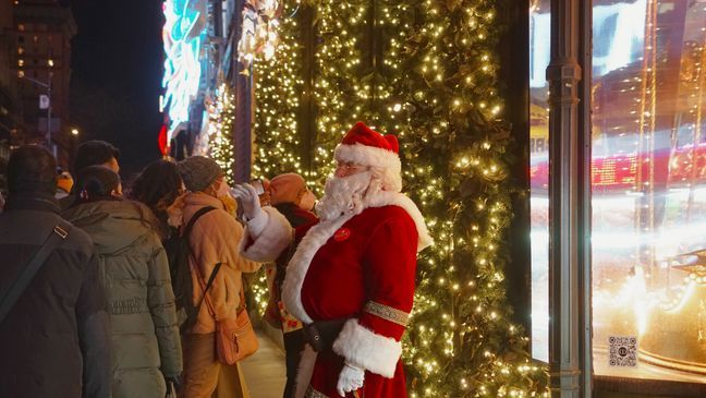 Swarms of tourists and Santas crowd the streets of Midtown Manhattan in the days leading up to Christmas. (Photo: Emily Faber, The National Desk)