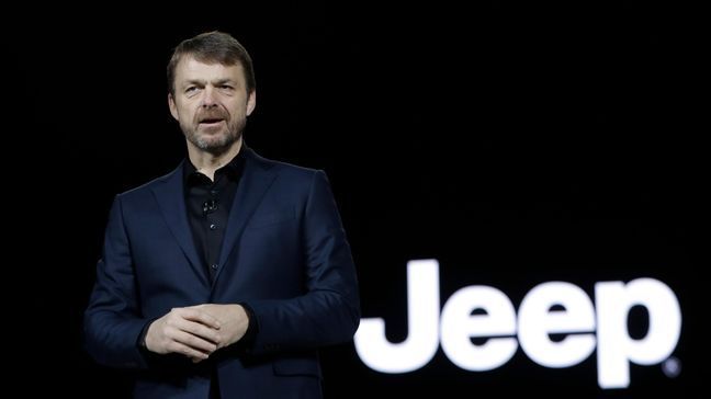 FILE - In this file photo dated Tuesday, Jan. 16, 2018, Mike Manley, head of Jeep Brand, introduces the 2019 Jeep Cherokee during the North American International Auto Show, in Detroit, USA.  Fiat Chrysler's board on Saturday July 20, 2018, has recommended Jeep executive Mike Manley to replace seriously ill CEO Sergio Marchionne. (AP Photo/Carlos Osorio, FILE)