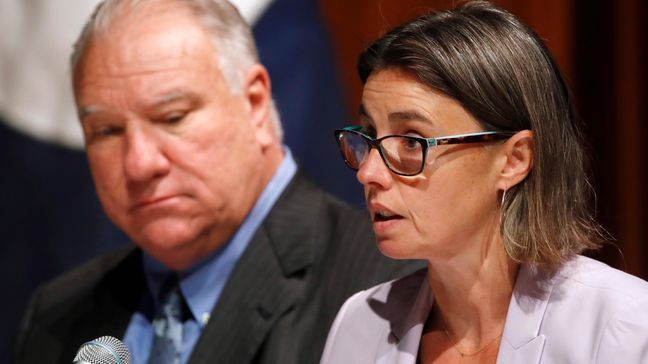 Jennifer Kelly, with the United Auto Workers, right, speaks during a Commerce Department hearing on investigation into whether auto imports threaten national security, Thursday, July 19, 2018, at the Commerce Department in Washington. At left is Clark Plucinski, with the Certified Automotive Parts Association.(AP Photo/Jacquelyn Martin)