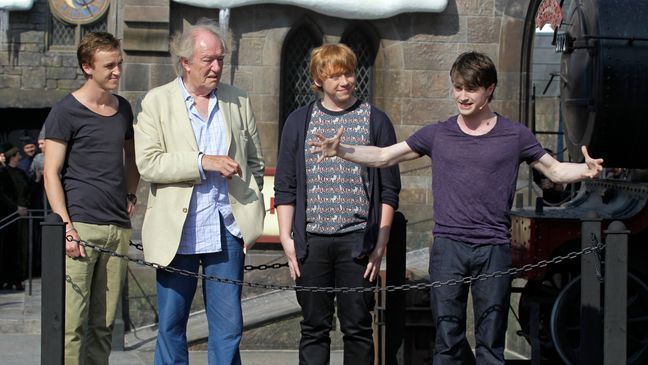 FILE - Members of the cast of the Harry Potter films, from left, Tom Felton, Michael Gambon, Rupert Grint, and Daniel Radcliffe during grand opening ceremonies of the Wizarding World of Harry Potter at Universal Orlando theme park in Orlando, Florida, Friday, June 18, 2010.{&nbsp;} (AP Photo/John Raoux, File)