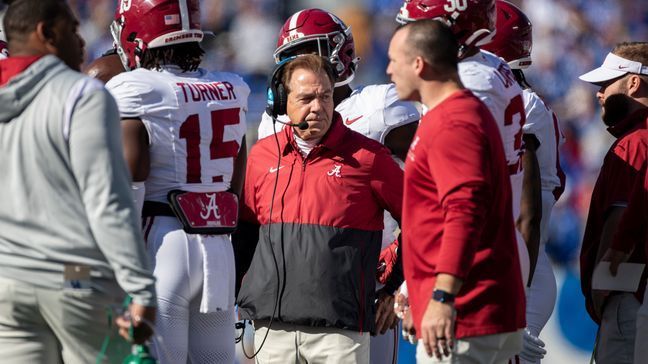 Alabama head coach Nick Saban stands in a huddle during the first half of an NCAA college football game against Kentucky in Lexington, Ky., Saturday, Nov. 11, 2023. (AP Photo/Michelle Haas Hutchins)