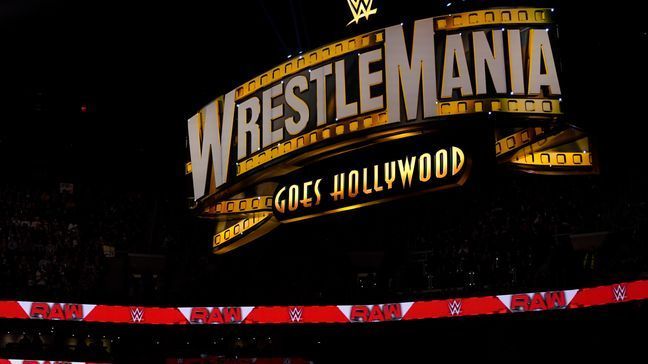 FILE - A WrestleMania sign hangs over the crowd during the WWE Monday Night RAW event, Monday, March 6, 2023, in Boston. (AP Photo/Charles Krupa, FIle)