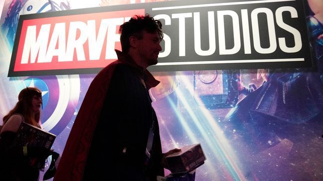 A cosplayer dressed as Doctor Strange passes by a Marvel Studios exhibit at the D23 Expo Saturday, Sept. 10, 2022, in Anaheim, Calif. (AP Photo/Mark J. Terrill)