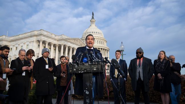 Rep. George Santos, R-N.Y., faces reporters at the Capitol in Washington, early Thursday, Nov. 30, 2023. (AP Photo/J. Scott Applewhite)