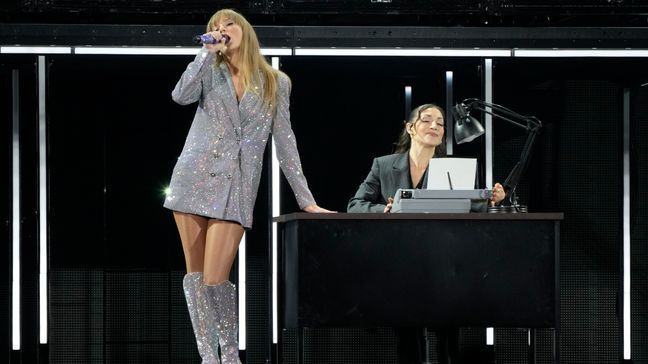 Taylor Swift, left, performs during the opener of her Eras tour Friday, March 17, 2023, at State Farm Stadium in Glendale, Ariz. (AP Photo/Ashley Landis)