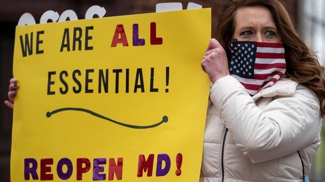 ANNAPOLIS, MD - APRIL 18:  Protesters with the group Reopen Maryland rally near the State House to call on the state to lift the stay-at-home order and reopen the economy on April 18, 2020 in Annapolis, Maryland. Most protestors rallied from inside their cars as they caused gridlock in a traffic circle and a smaller group protested outside of their cars. (Photo by Drew Angerer/Getty Images)