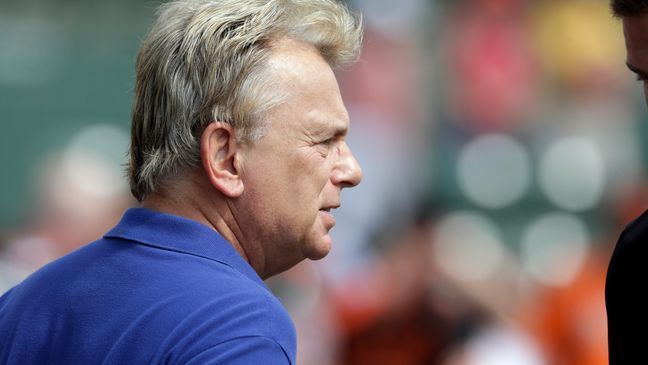 Wheel of Fortune host Pat Sajak is seen during batting practice before a spring exhibition baseball game between the Baltimore Orioles and the Pittsburgh Pirates in Sarasota, Fla., Sunday, March 23, 2014. (AP Photo/Carlos Osorio)