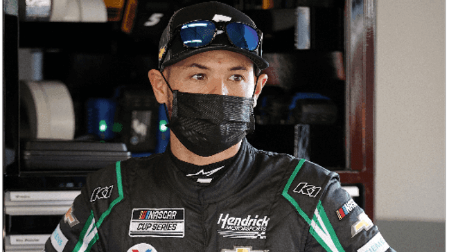 DAYTONA BEACH, FLORIDA - FEBRUARY 10: Kyle Larson, driver of the #5 Nations Guard Chevrolet,  stands in the garage area during practice for the NASCAR Cup Series 63rd Annual Daytona 500 at Daytona International Speedway on February 10, 2021 in Daytona Beach, Florida. (Photo by Chris Graythen/Getty Images)