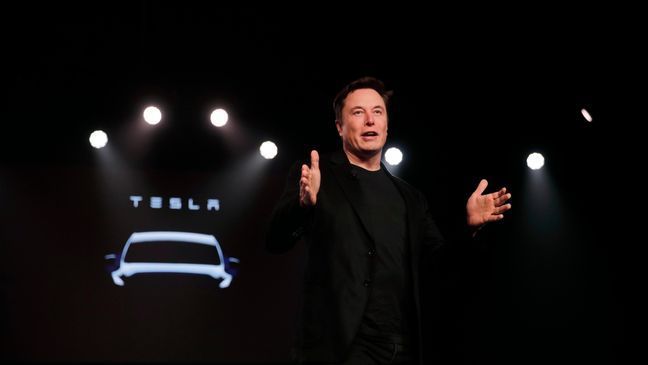 FILE- In this March 14, 2019, file photo Tesla CEO Elon Musk speaks before unveiling the Model Y at Tesla's design studio in Hawthorne, Calif. (AP Photo/Jae C. Hong, File)