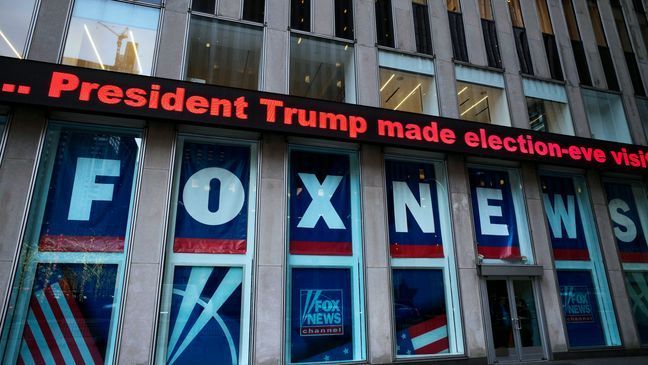 FILE - A headline about President Donald Trump is displayed outside Fox News studios in New York on Nov. 28, 2018.{&nbsp;} (AP Photo/Mark Lennihan, File)