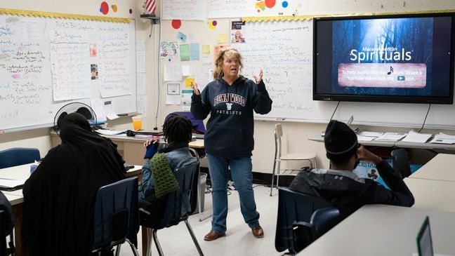 FILE - World literature teacher Ann Marie Willoughby speaks with students at Penn Wood High School in Lansdowne, Pa., Wednesday, May 3, 2023. (AP Photo/Matt Rourke)