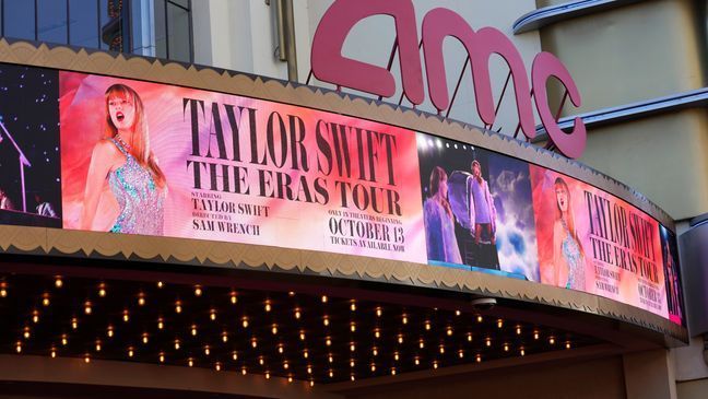 A marquee featuring the concert film "Taylor Swift: The Eras Tour" is seen prior to the world premiere on Wednesday, Oct. 11, 2023, at AMC The Grove 14 in Los Angeles. (AP Photo/Chris Pizzello)