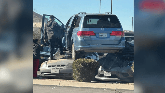 A van somehow landed atop 2 other vehicles at Bassett Place, a mall in El Paso, Jan. 18, 2023. (Jonathan Rogelio Villanueva)