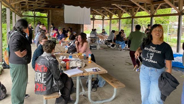 The waft of garlic welcomed a crowd of new friends at Seattle's Meridian Park on this happy Monday afternoon in Wallingford. After a poster for the event{&nbsp;}{a href="https://www.tiktok.com/@fendihendrixx/video/7368103963775749418?lang=en" target="_blank"}went viral on TikTok{/a}{&nbsp;}with over 4 million views and a promise of simplistic joy, locals gathered just as advertised for Gays Eating Garlic Bread in a Park! We obviously had to check it out and this event did not disappoint. I was promptly greeted by a friendly face and offered garlic bread upon arrival (the homemade spread was delicious)! The welcoming and diverse crowd stretched from organizers to folx joining solo or with pals, plus tiny tots, cute dogs and garlic bread galore - along with free drinks, sides of fruit, spaghetti, tons of games and generally awesome vibes. It was a very Seattle Monday, in the best way.{&nbsp;}{a href="https://www.tiktok.com/@seattlerefined/video/7368706807155412266?lang=en" target="_blank"}View our TikTok here{/a}. (Image: Seattle Refined) May 13, 2024{&nbsp;}