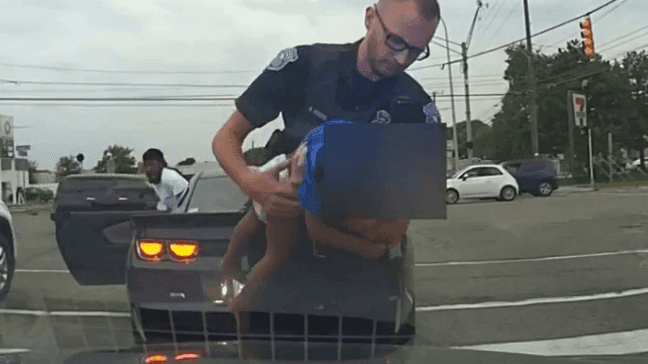 An 18-month-old child struggling to breathe is saved by an officer during a traffic stop in Warren, Wis. (Screenshot from video courtesy of Warren Police Department)