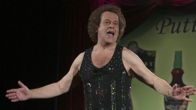 FILE - In this June 2, 2006, file photo, Richard Simmons speaks to the audience before the start of a summer salad fashion show at Grand Central Terminal in New York. (AP Photo/Tina Fineberg, File)