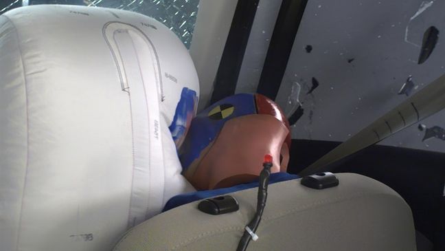 The dummy's head contacted the frontal airbag in the 2018 Ford Escape but then rolled around to the right. The side curtain airbag did not deploy, uncommon for 2018 model year and later vehicles. (Image courtesy of the Insurance Institute for Highway Safety)