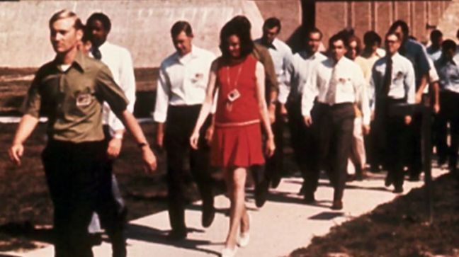 The FBI Academy in 1972, when Joanne Pierce Misko, seen in the red dress, and Susan Roley Malone, partially visible near the back of the group, were sworn in as special agents. (Photo: Federal Bureau of Investigation)