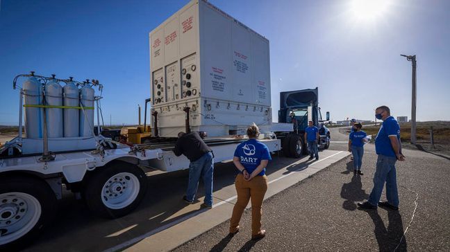 {p}DART packed and ready to move to SpaceX. DART team members stand outside Astrotech Space Operations processing facility with the shipment container holding the DART spacecraft. DART moved to SpaceX’s payload processing facility late last month. Credits: NASA/Johns Hopkins APL/Ed Whitman{/p}